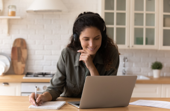 an image of a person focused on working on their laptop.